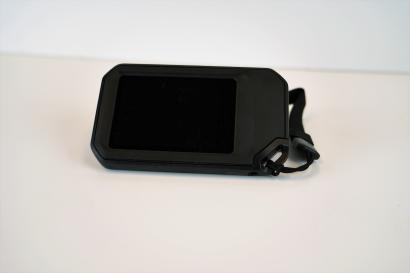 camera turned off resting on white table