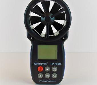 anemometer turned off standing up right on white table