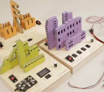 power grid set up on wooden platforms with circuits layed out on table