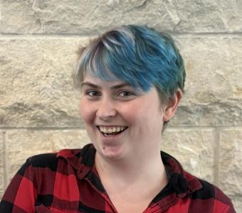 Brie in front of limestone wall 2025